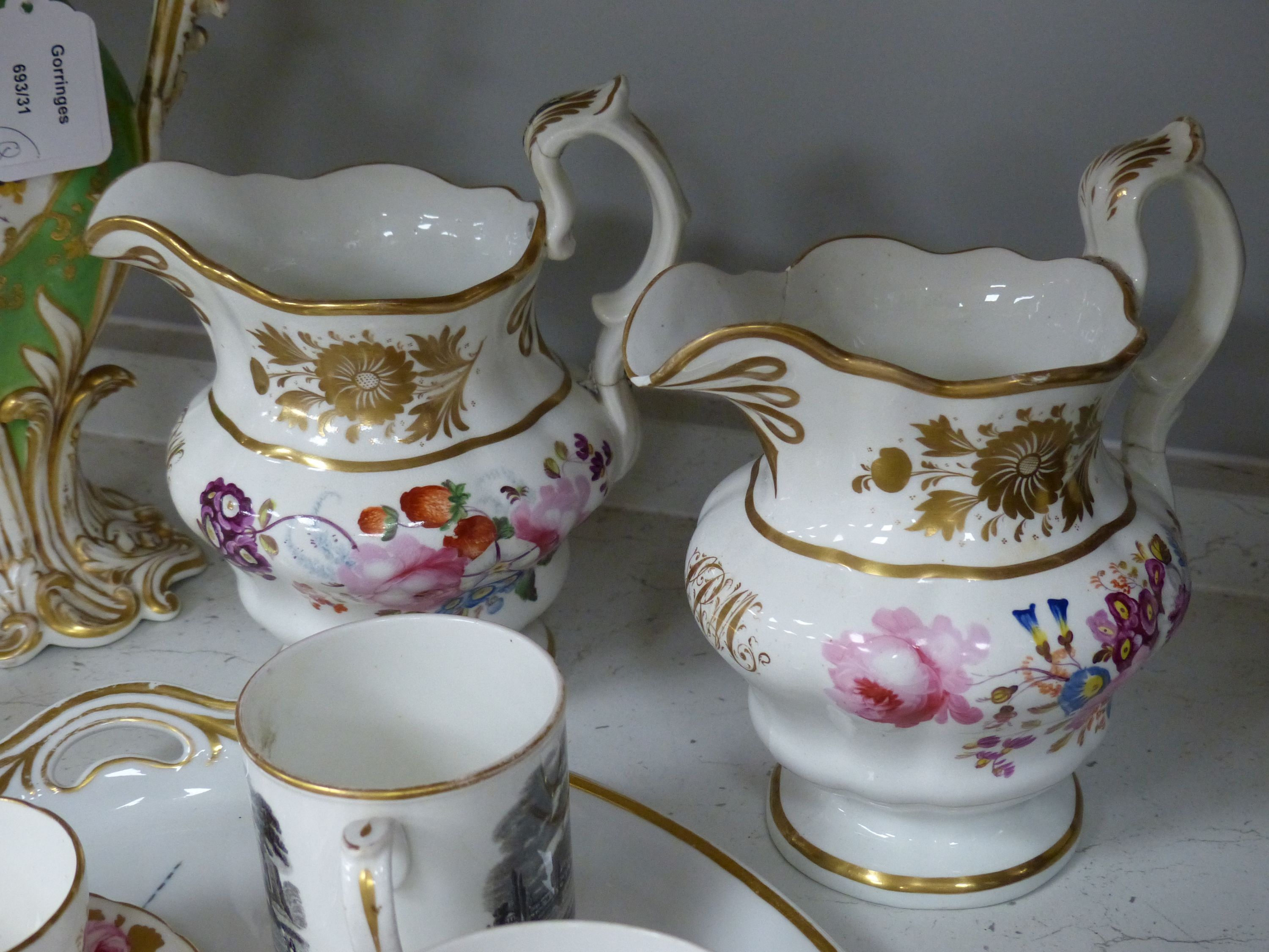 A Continental porcelain two handled tray painted with flowers and gilded with initials, a large English vase, a pair of Delft of vases, two Foley cup and saucers, two English jugs and other items